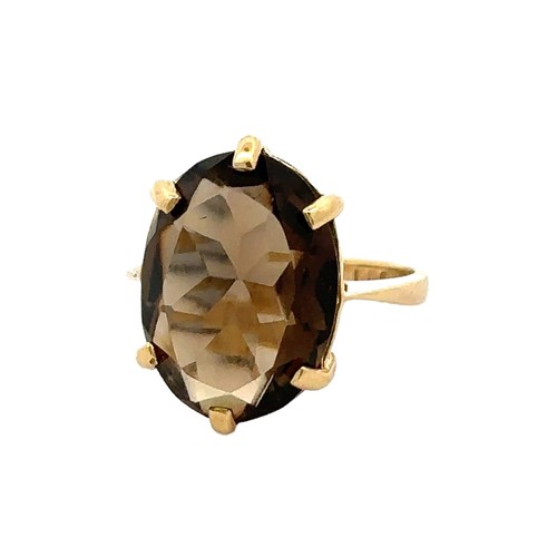 87 - A smoky quartz  set in 18ct gold, size L. Smoky quartz 16mm x 12mm. Weight 5.02g.

Please see the bu... 