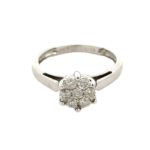 62 - A diamond cluster ring set with seven diamonds, size K. Stamped 18kt and marked as 0.33ct of diamond... 