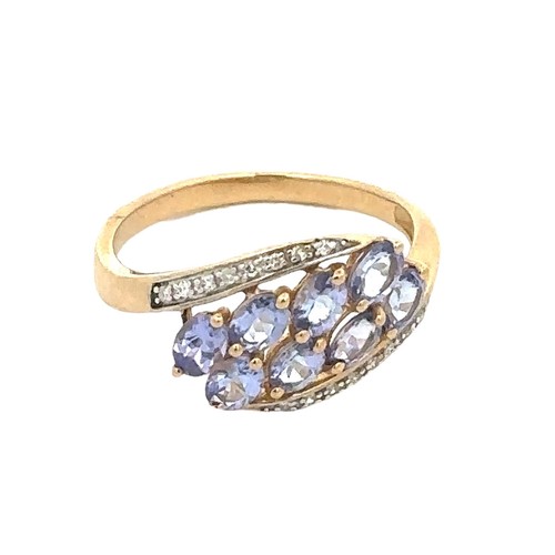 73 - A hallmarked 9ct gold, tanzanite and diamond ring, size P. Weight 2.52g.
Good condition overall. Sto... 