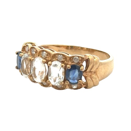 77 - A white sapphire and blue topaz ring with diamond accents. Size S, stamped 9K. Weight 4.95g.
Good co... 