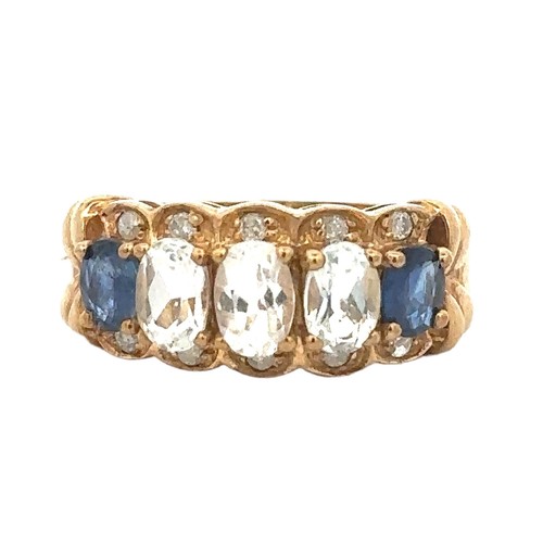 77 - A white sapphire and blue topaz ring with diamond accents. Size S, stamped 9K. Weight 4.95g.
Good co... 