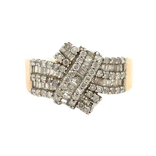 79 - A hallmarked 9ct gold and diamond dress ring set with round and baguette cut diamonds, size O,  Weig... 