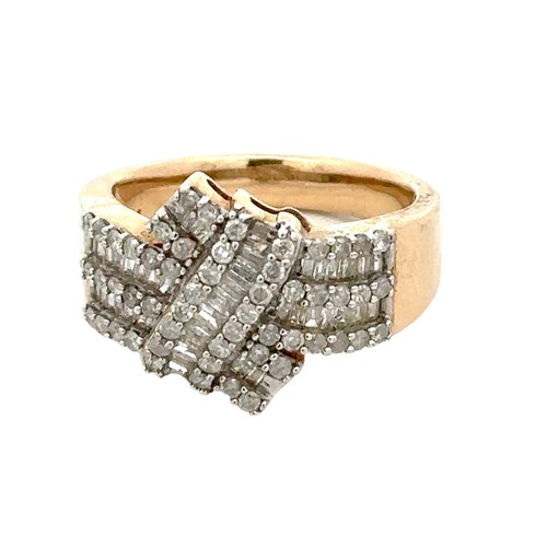 79 - A hallmarked 9ct gold and diamond dress ring set with round and baguette cut diamonds, size O,  Weig... 