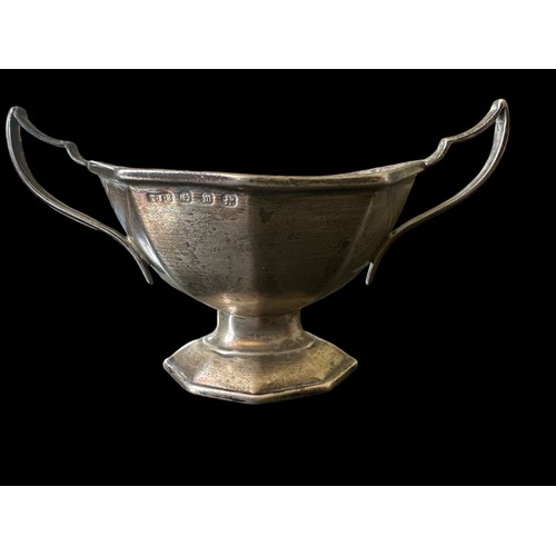 128 - A small silver octagonal twin-handled bowl, marked E.S. Barnsley & Co, Birmingham 1911. Weight 43g.