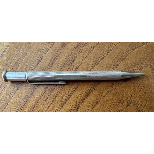 130 - A silver pencil with Birmingham 1964 hallmarks. Length 117mm approx, weight 16g. Name plate is not e... 