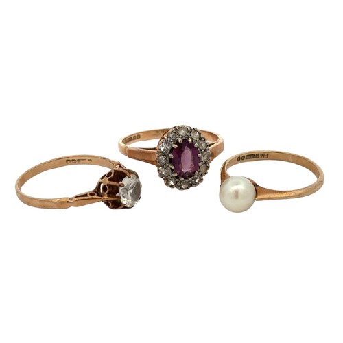 86 - Three 9ct gold rings -  a purple and white paste cluster ring, size O, a pearl ring size L, a white ... 