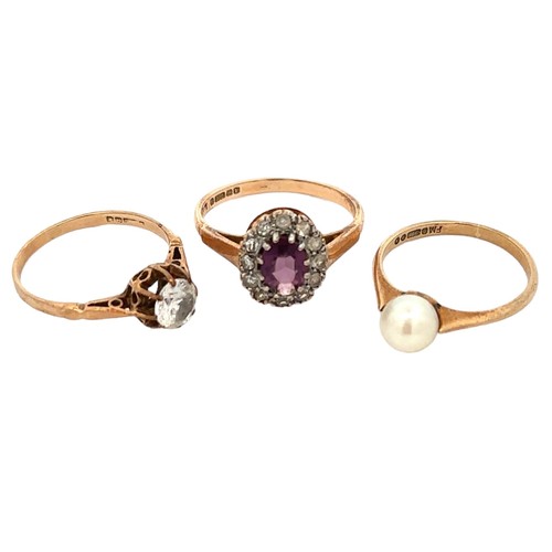 86 - Three 9ct gold rings -  a purple and white paste cluster ring, size O, a pearl ring size L, a white ... 