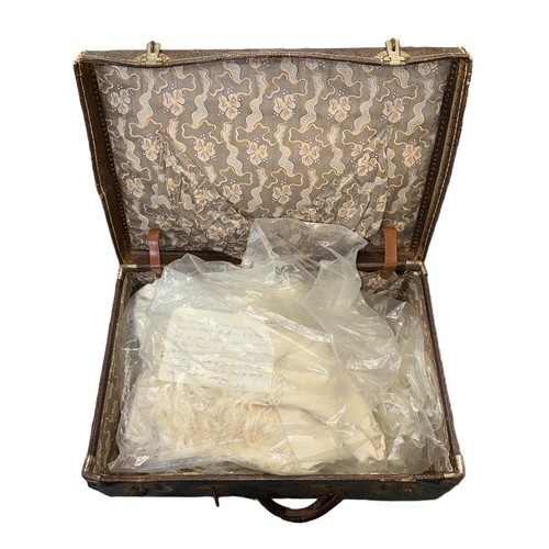 322 - Victorian embroidered shawl and Christening gown, in small brown suitcase.