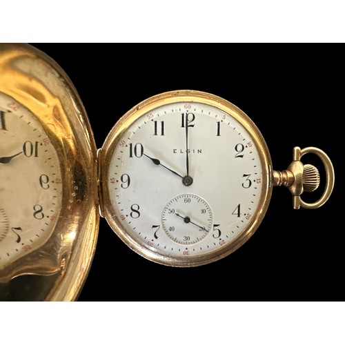 100 - A full hunter gold pocket watch, stamped 585 14K with an engraved case. White enamel dial with Arabi... 