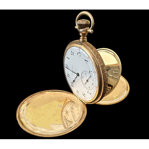 100 - A full hunter gold pocket watch, stamped 585 14K with an engraved case. White enamel dial with Arabi... 