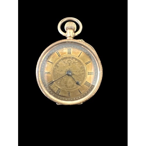 101 - An open face pocket watch stamped 14K. Gold dial with foliate design and Roman numerals hour markers... 