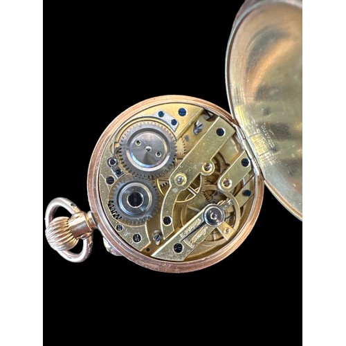 101 - An open face pocket watch stamped 14K. Gold dial with foliate design and Roman numerals hour markers... 