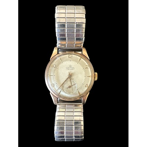 109 - A Smiths De Luxe 15 jewel 9ct gold watch, No. C255167. Case approx 31mm diameter, Arabic numerals at... 