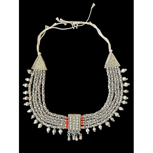 94 - An unmarked white metal necklace with red beads, purchased in the United Arab Emirates (UAE).

Pleas... 