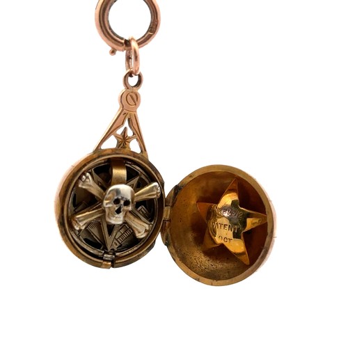 175 - A rare 9ct gold Masonic fob/ orb pendant. The engraved hinged orb opens to reveal four hinged gold s... 