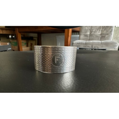 132 - Docker & Burn silver napkin ring engraved with letter ‘F’ to the front and inscribed ‘Christmas 1928... 