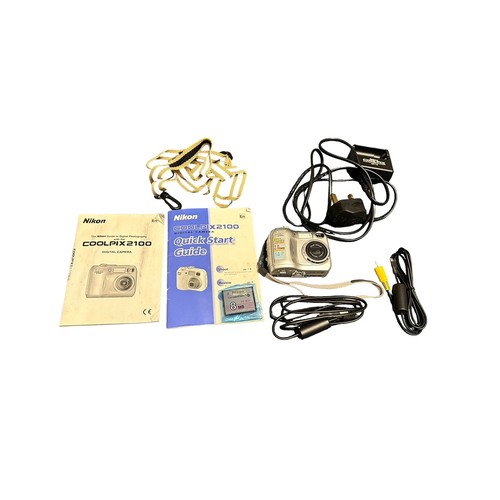 351A - 2x Digital Cameras. 1x Nikon Coolpix 2100 with original box, instruction booklet, charger, AV leads,... 