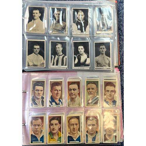 296 - A collection of football cigarette cards, mainly complete sets in plastic sleeves, in two albums, in... 