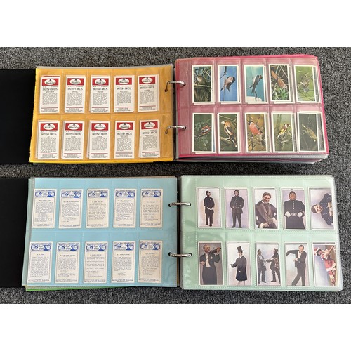 297 - A collection of cigarette cards, mainly complete sets, sleeved in four albums, in good to excellent ... 