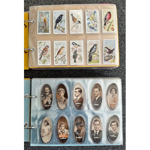 297 - A collection of cigarette cards, mainly complete sets, sleeved in four albums, in good to excellent ... 