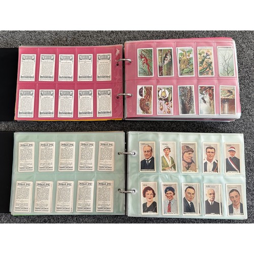 297 - A collection of cigarette cards, mainly complete sets, sleeved in four albums, in good to excellent ... 