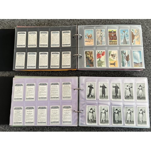 297 - A collection of cigarette cards, mainly complete sets, sleeved in four albums, in good to excellent ... 