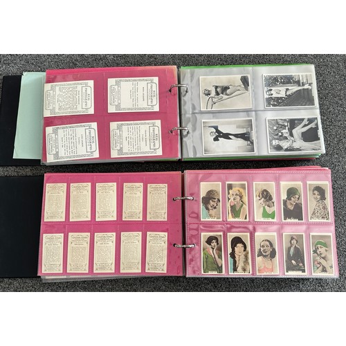 297 - A collection of cigarette cards, mainly complete sets, sleeved in four albums, in good to excellent ... 