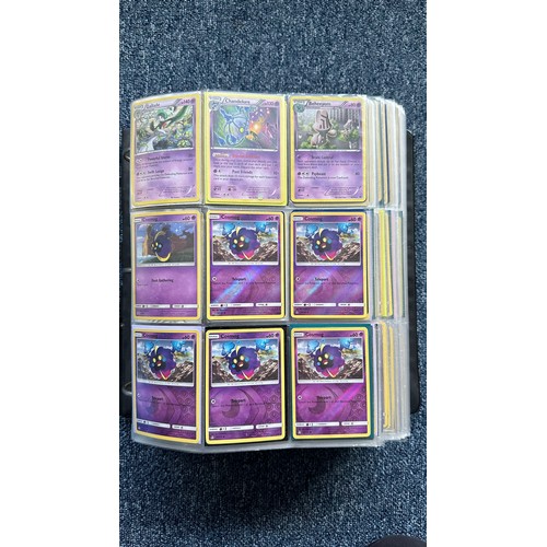 403 - A folder containing duplicates of Pokemon cards. Various sets and series including Base Set, Ultra P... 