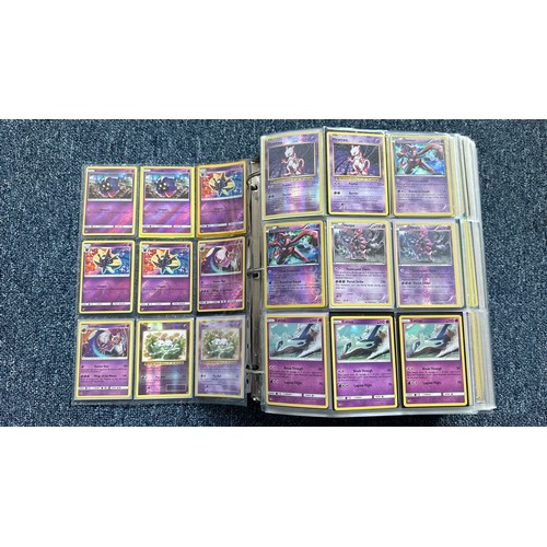 403 - A folder containing duplicates of Pokemon cards. Various sets and series including Base Set, Ultra P... 