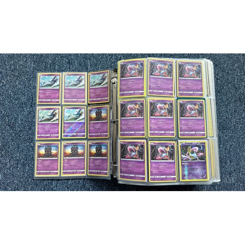 403 - A folder containing duplicates of Pokemon cards. Various sets and series including Base Set, Ultra P... 