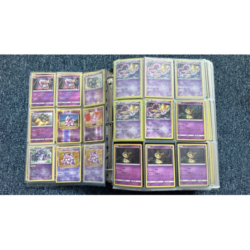 403 - A folder containing duplicates of Pokemon cards. Various sets and series including Base Set, Ultra P... 