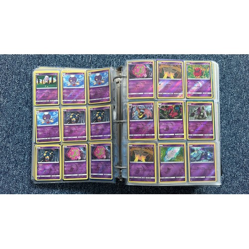 403 - A folder containing duplicates of Pokemon cards. Various sets and series including Base Set, Ultra P... 