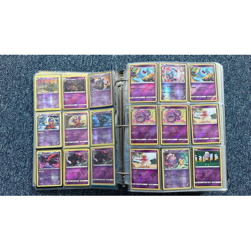 403 - A folder containing duplicates of Pokemon cards. Various sets and series including Base Set, Ultra P... 