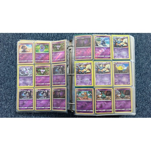 403 - A folder containing duplicates of Pokemon cards. Various sets and series including Base Set, Ultra P... 