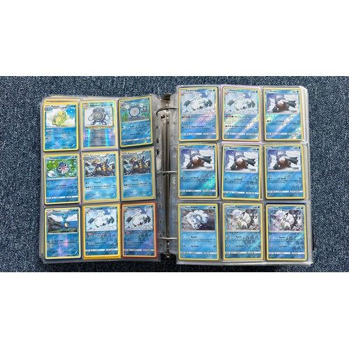 403 - A folder containing duplicates of Pokemon cards. Various sets and series including Base Set, Ultra P... 