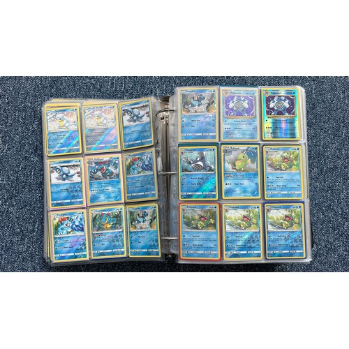 403 - A folder containing duplicates of Pokemon cards. Various sets and series including Base Set, Ultra P... 