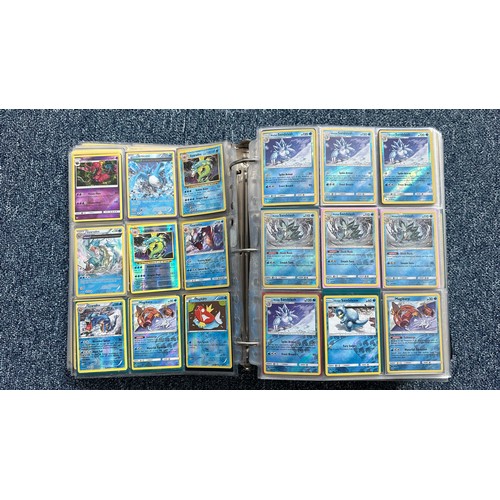 403 - A folder containing duplicates of Pokemon cards. Various sets and series including Base Set, Ultra P... 