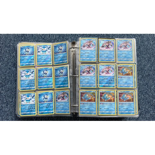 403 - A folder containing duplicates of Pokemon cards. Various sets and series including Base Set, Ultra P... 