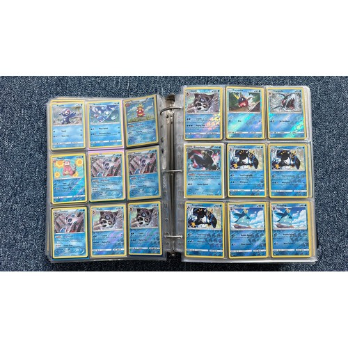 403 - A folder containing duplicates of Pokemon cards. Various sets and series including Base Set, Ultra P... 