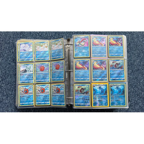 403 - A folder containing duplicates of Pokemon cards. Various sets and series including Base Set, Ultra P... 