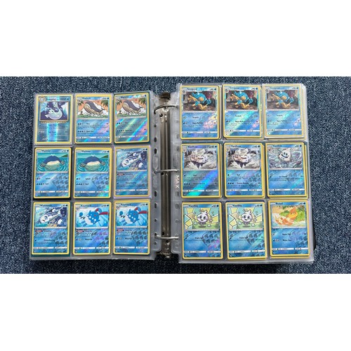 403 - A folder containing duplicates of Pokemon cards. Various sets and series including Base Set, Ultra P... 