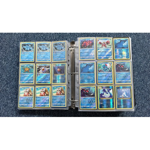 403 - A folder containing duplicates of Pokemon cards. Various sets and series including Base Set, Ultra P... 