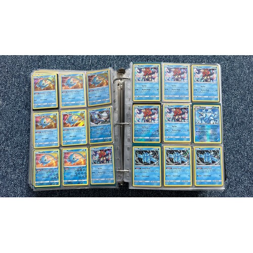 403 - A folder containing duplicates of Pokemon cards. Various sets and series including Base Set, Ultra P... 