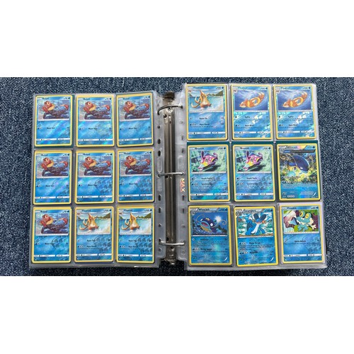 403 - A folder containing duplicates of Pokemon cards. Various sets and series including Base Set, Ultra P... 