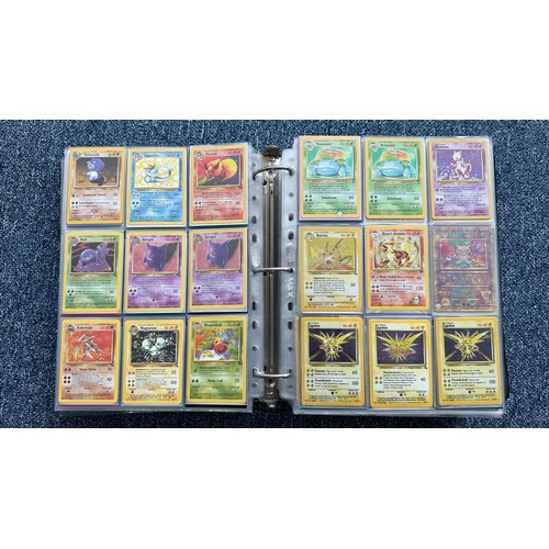 403 - A folder containing duplicates of Pokemon cards. Various sets and series including Base Set, Ultra P... 