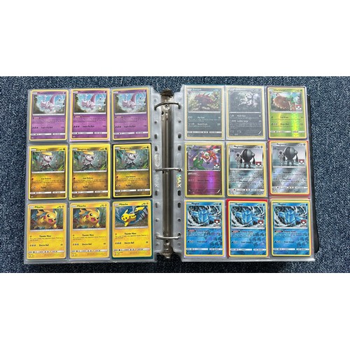 403 - A folder containing duplicates of Pokemon cards. Various sets and series including Base Set, Ultra P... 