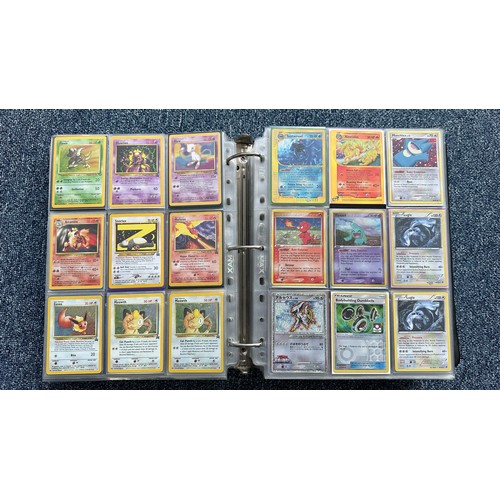 403 - A folder containing duplicates of Pokemon cards. Various sets and series including Base Set, Ultra P... 