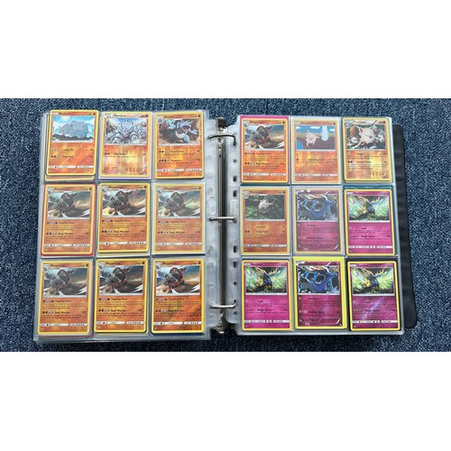 403 - A folder containing duplicates of Pokemon cards. Various sets and series including Base Set, Ultra P... 