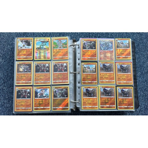 403 - A folder containing duplicates of Pokemon cards. Various sets and series including Base Set, Ultra P... 