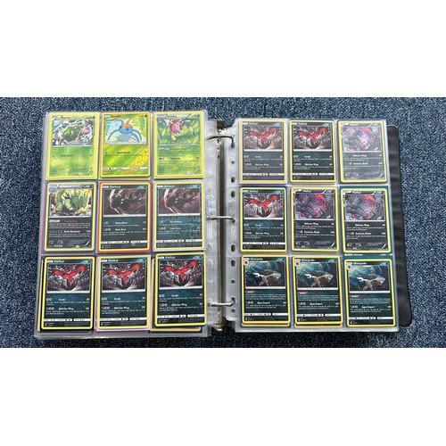 403 - A folder containing duplicates of Pokemon cards. Various sets and series including Base Set, Ultra P... 